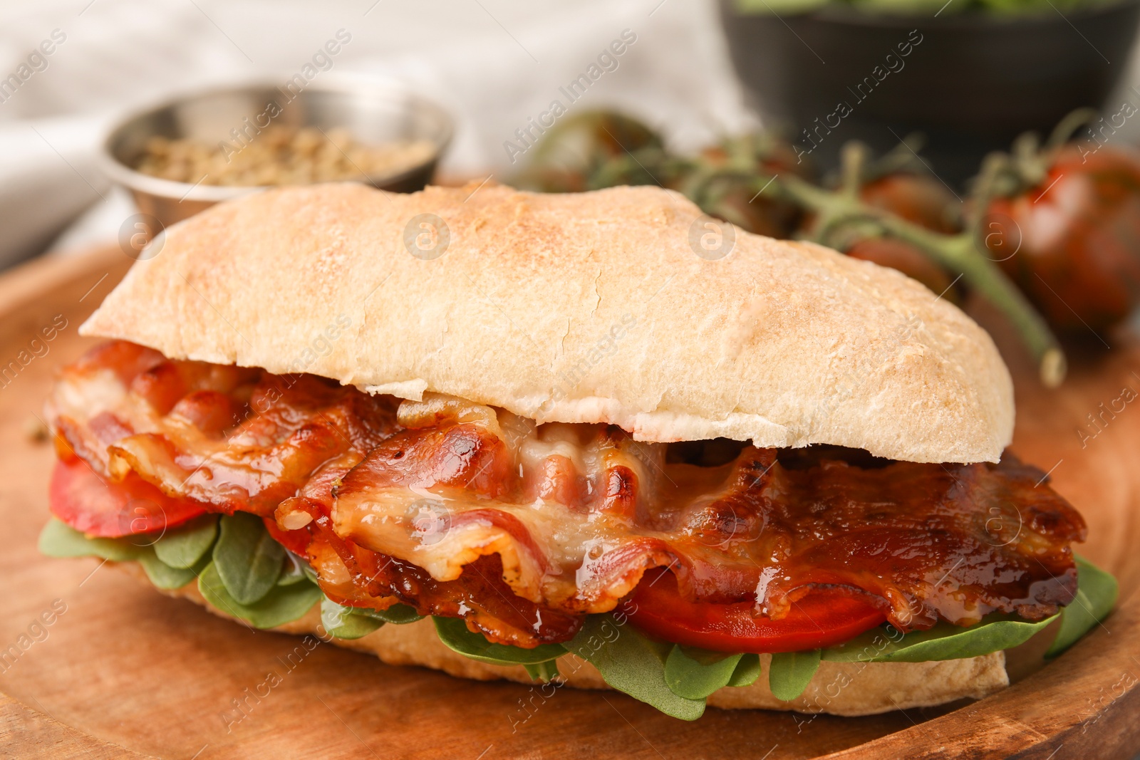 Photo of Tasty sandwich with bacon on table, closeup