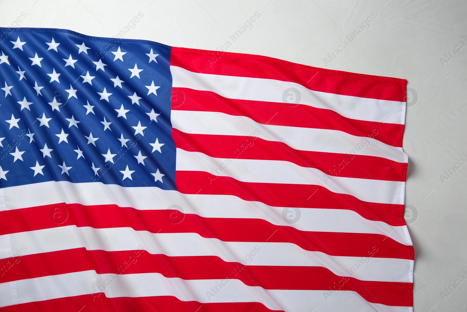 Photo of Flag of USA on white table, top view