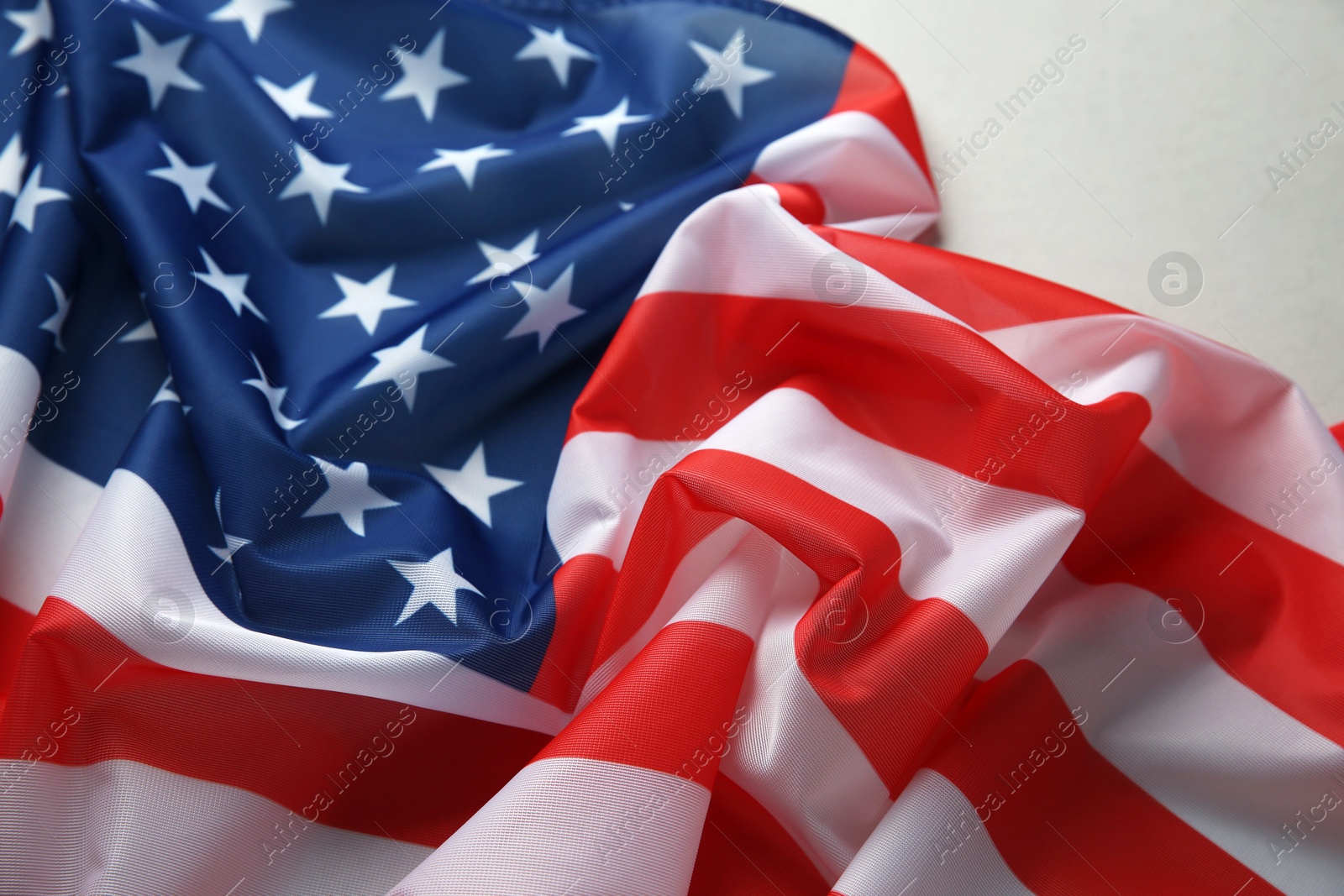 Photo of Flag of USA on white table, closeup