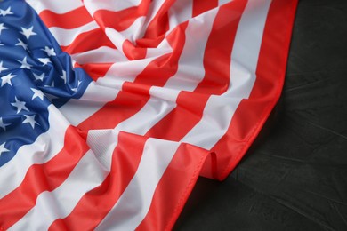 Photo of Flag of USA on black table, closeup