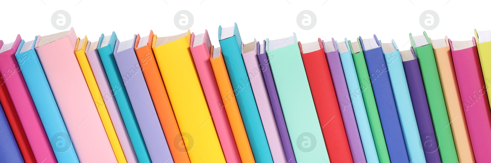 Photo of Many bright colorful books against white background