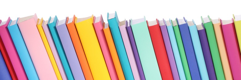 Many bright colorful books against white background