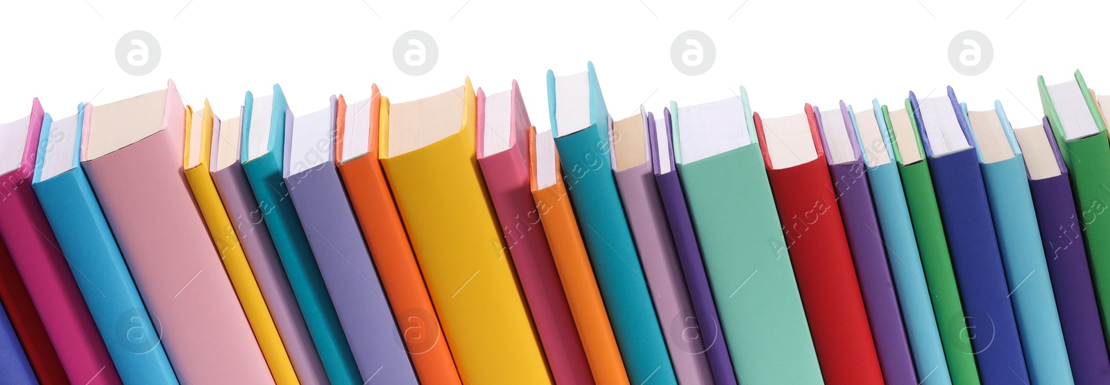 Photo of Many bright colorful books against white background