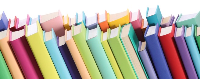 Many bright colorful books against white background