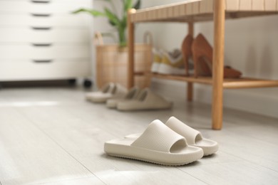 Photo of Pair of slippers in entryway at home