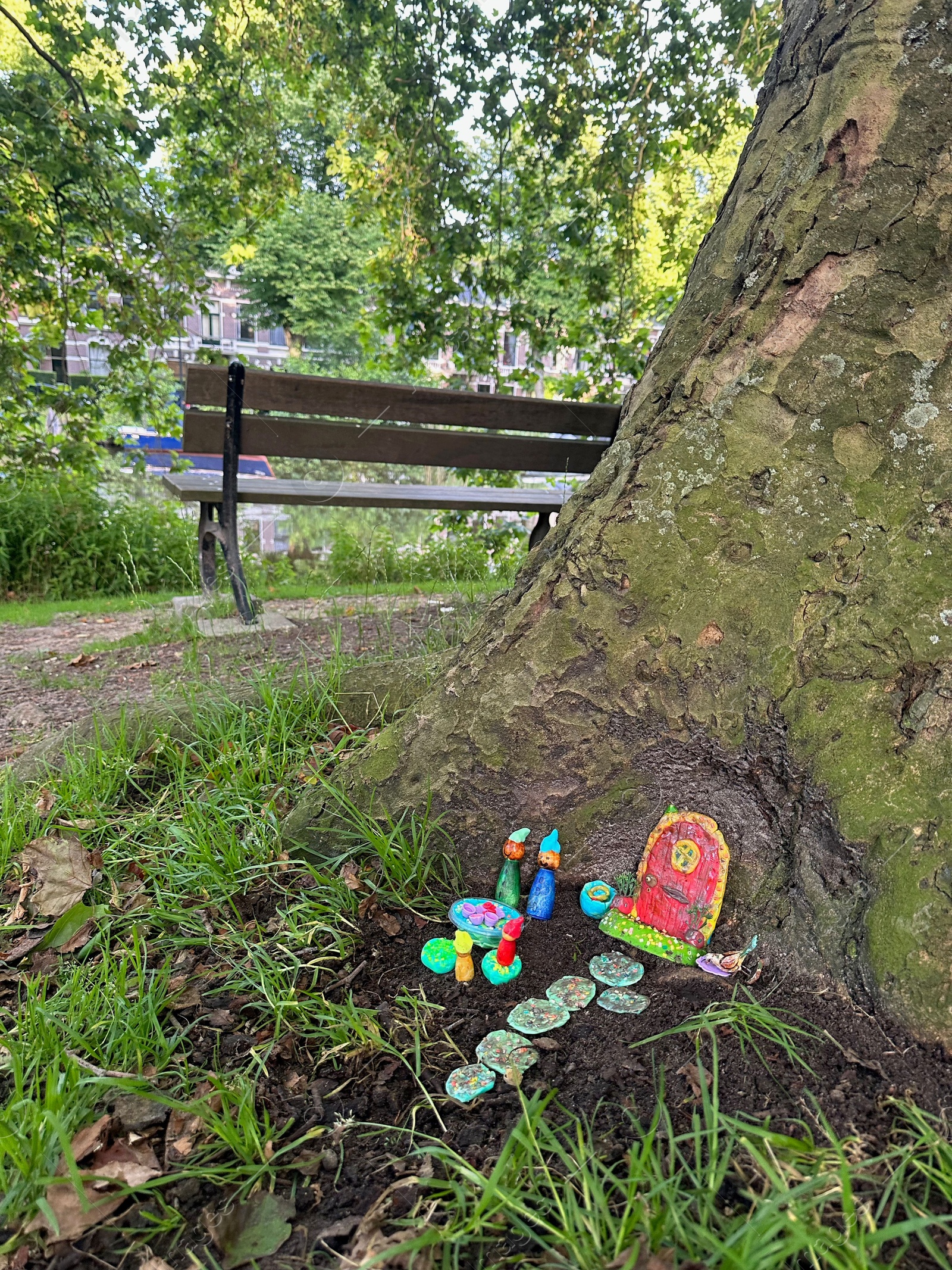 Photo of Beautiful gnome`s house under tree outdoors. Dutch tradition