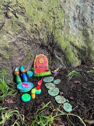 Photo of Beautiful gnome`s house under tree outdoors. Dutch tradition