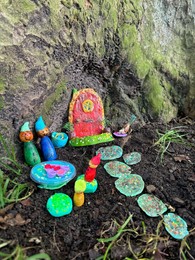 Photo of Beautiful gnome`s house under tree outdoors. Dutch tradition