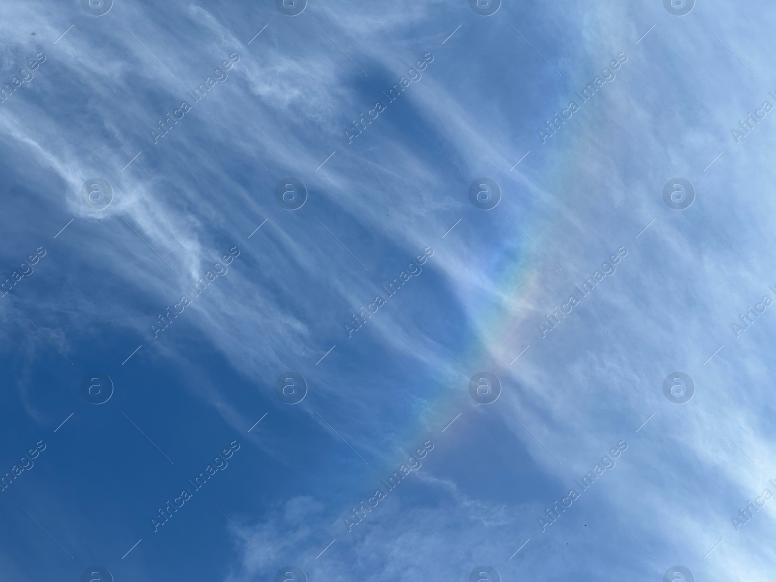 Photo of Beautiful blue sky with rainbow, low angle view