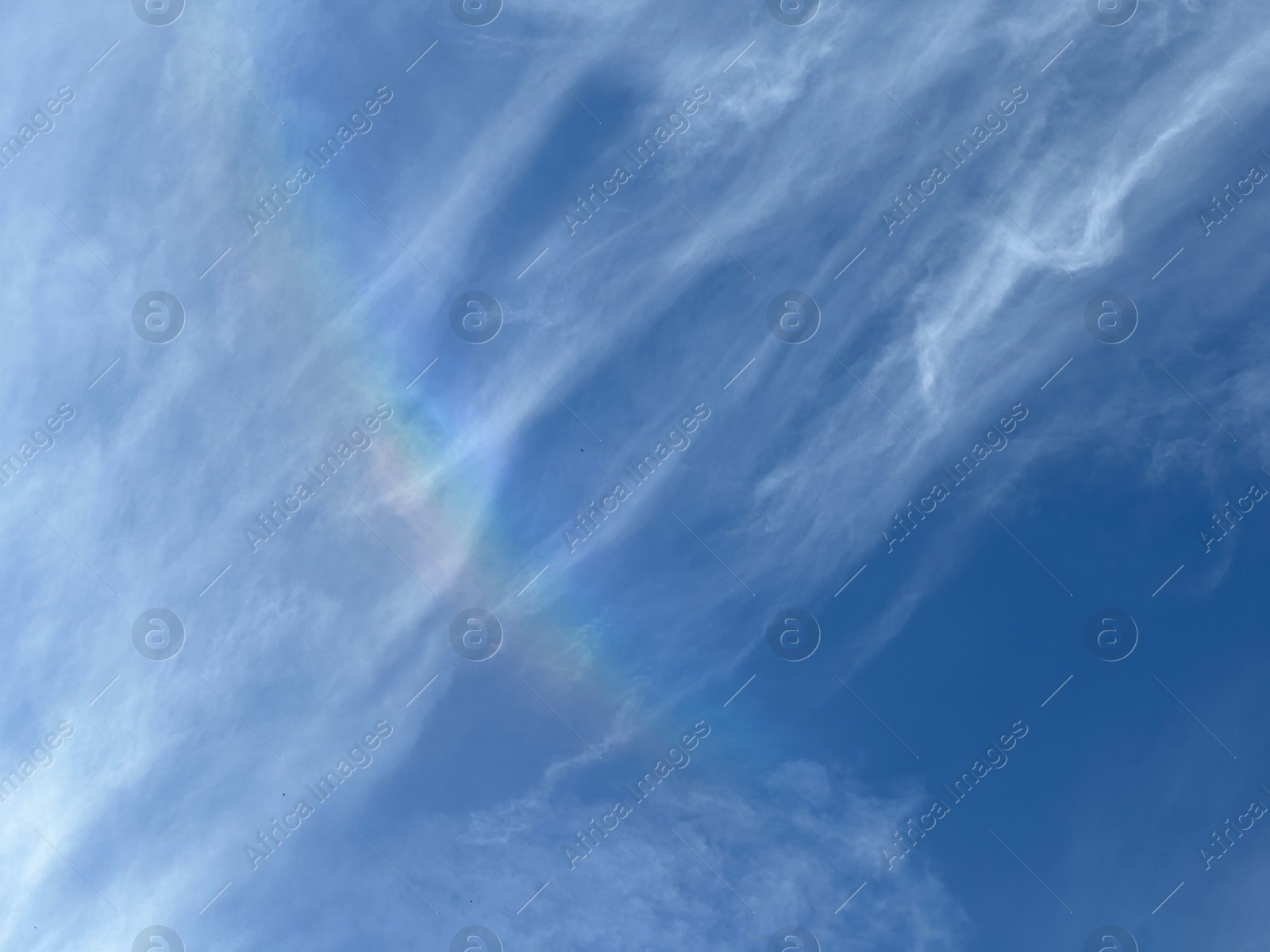 Photo of Beautiful blue sky with rainbow, low angle view