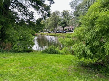 Photo of Picturesque view of canal and trees outdoors