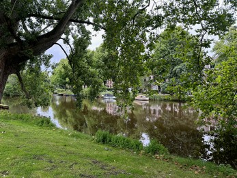 Photo of Picturesque view of canal and trees outdoors