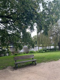 Photo of Beautiful view of wooden bench in park