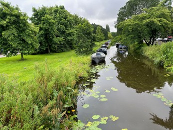 Photo of Picturesque view of canal with moored boats