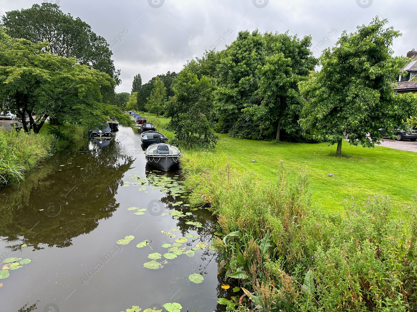 Photo of Picturesque view of canal with moored boats