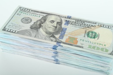 Photo of Dollar banknotes on white background, closeup view