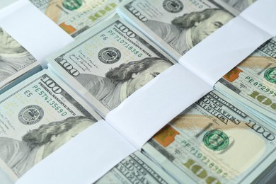 Photo of Many dollar banknotes as background, closeup view