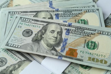 Photo of Many dollar banknotes as background, closeup view