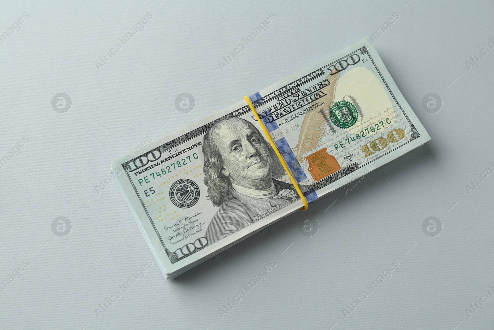 Photo of Dollar banknotes on grey background, top view