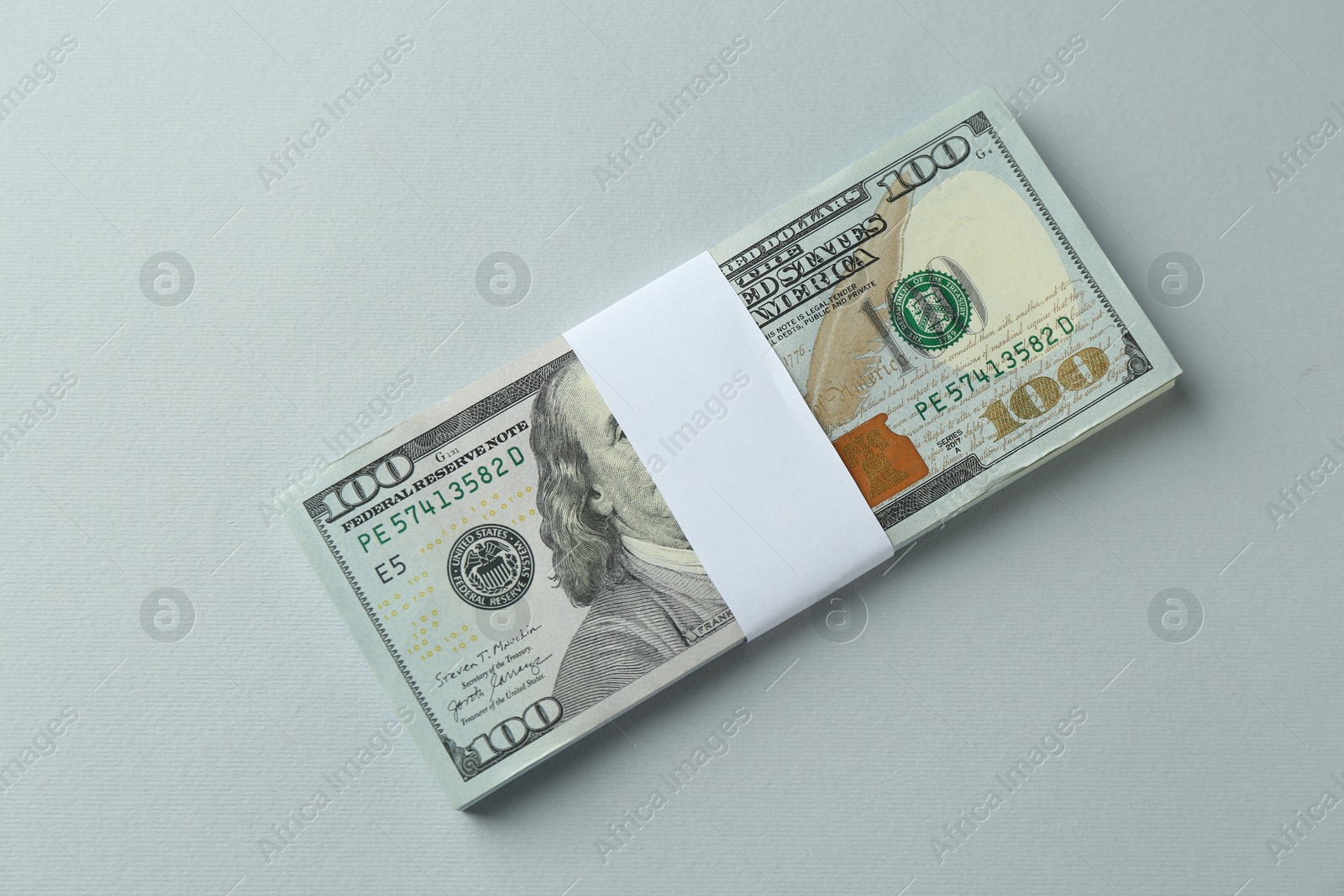 Photo of Dollar banknotes on grey background, top view