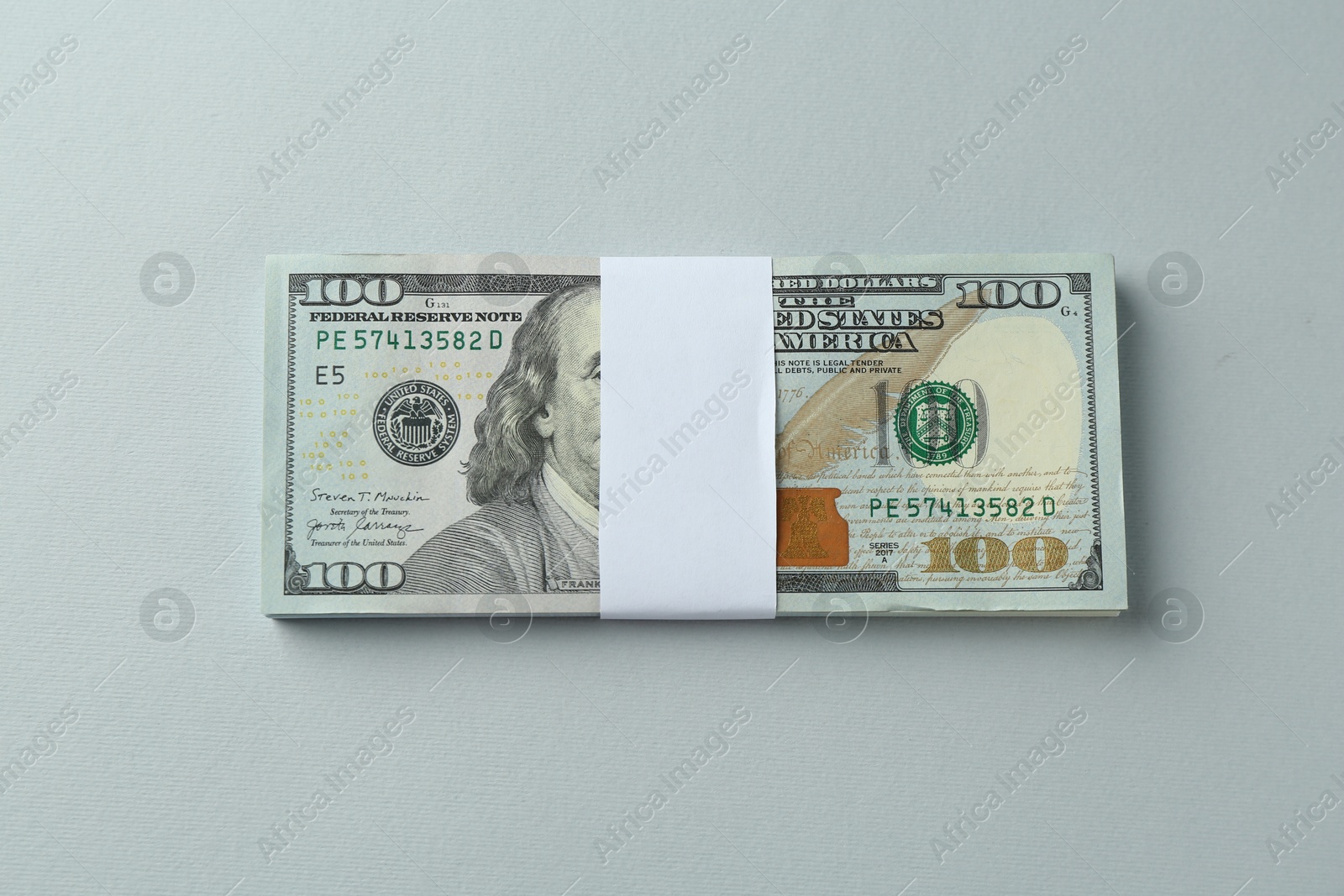 Photo of Dollar banknotes on grey background, top view