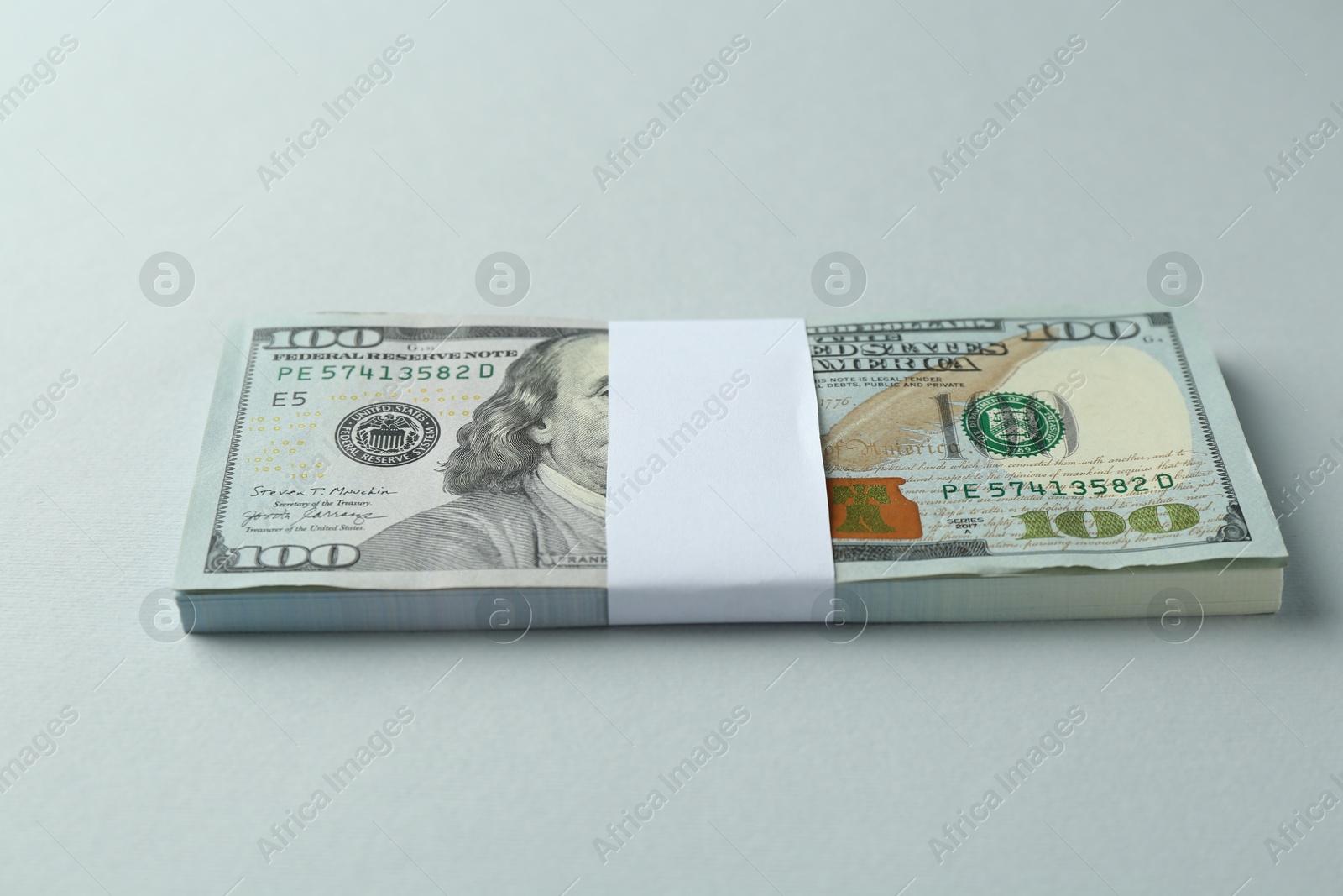 Photo of Dollar banknotes on grey background. American currency