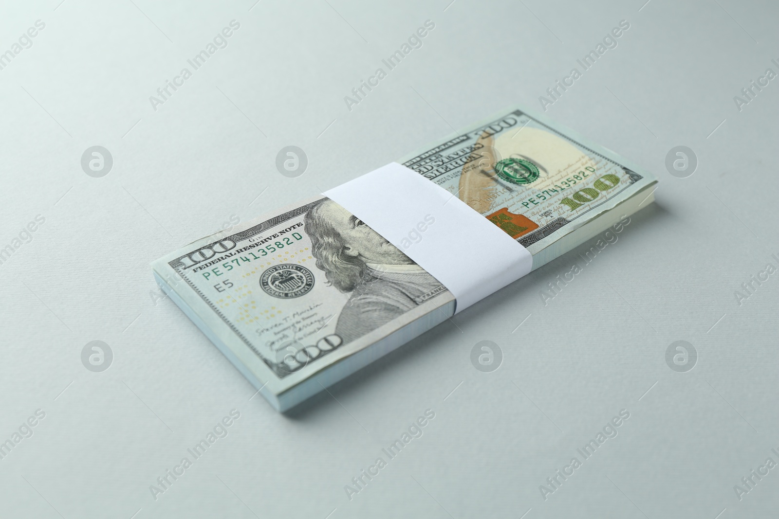 Photo of Dollar banknotes on grey background. American currency