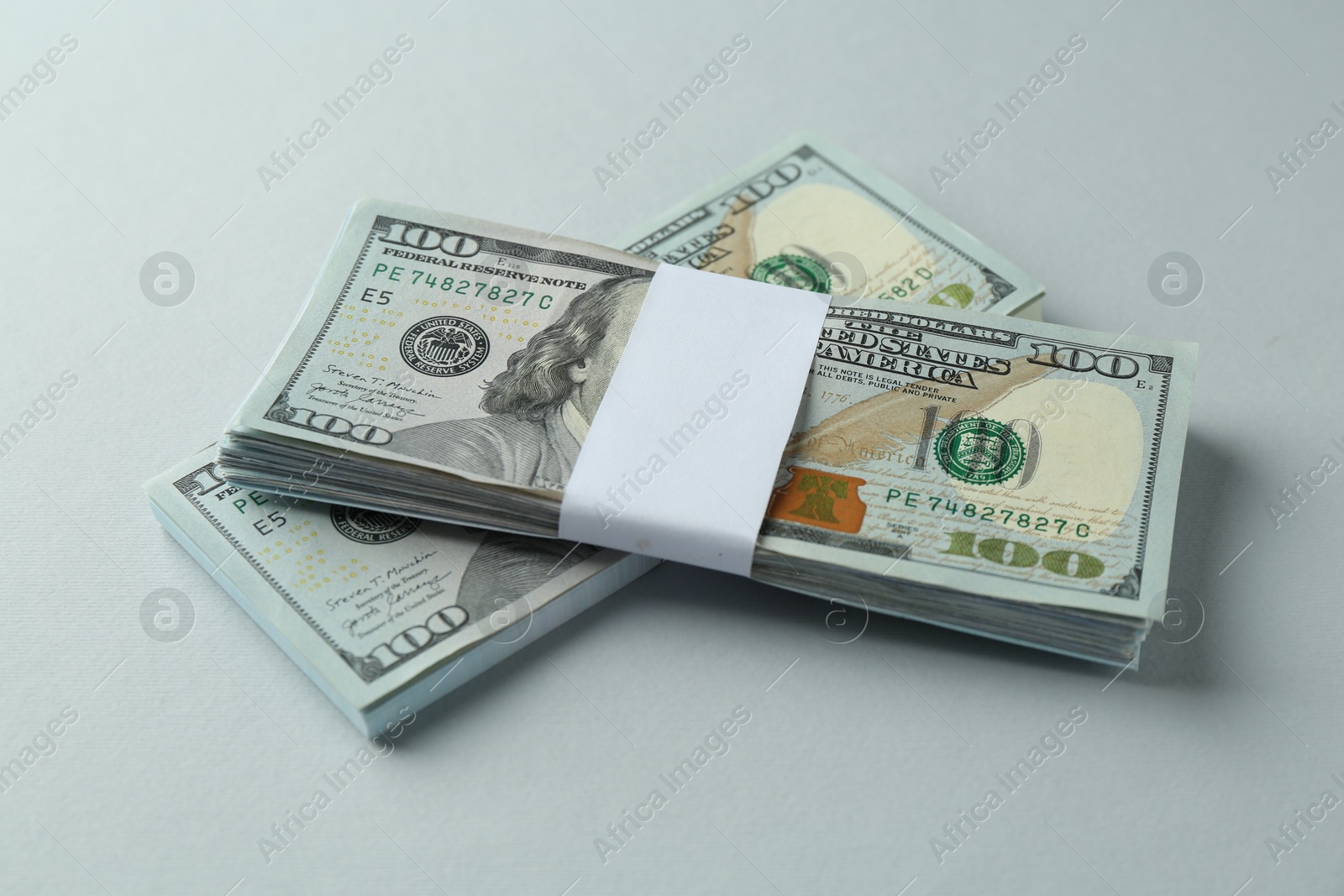 Photo of Dollar banknotes on grey background. American currency