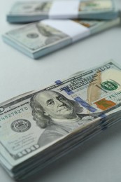 Photo of Dollar banknotes on grey background, closeup. American currency