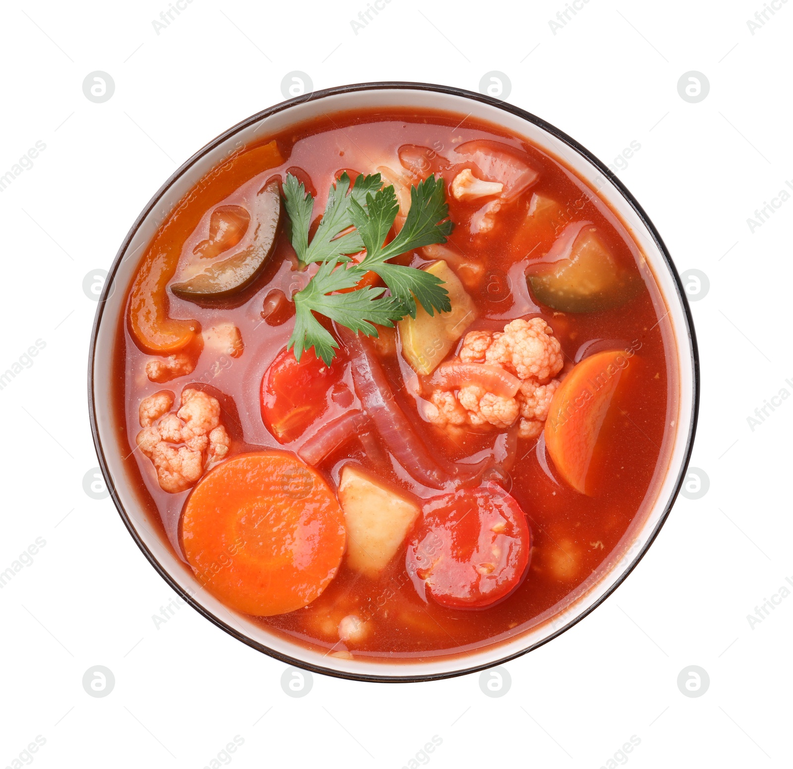 Photo of Tasty homemade stew with vegetables in bowl isolated on white, top view