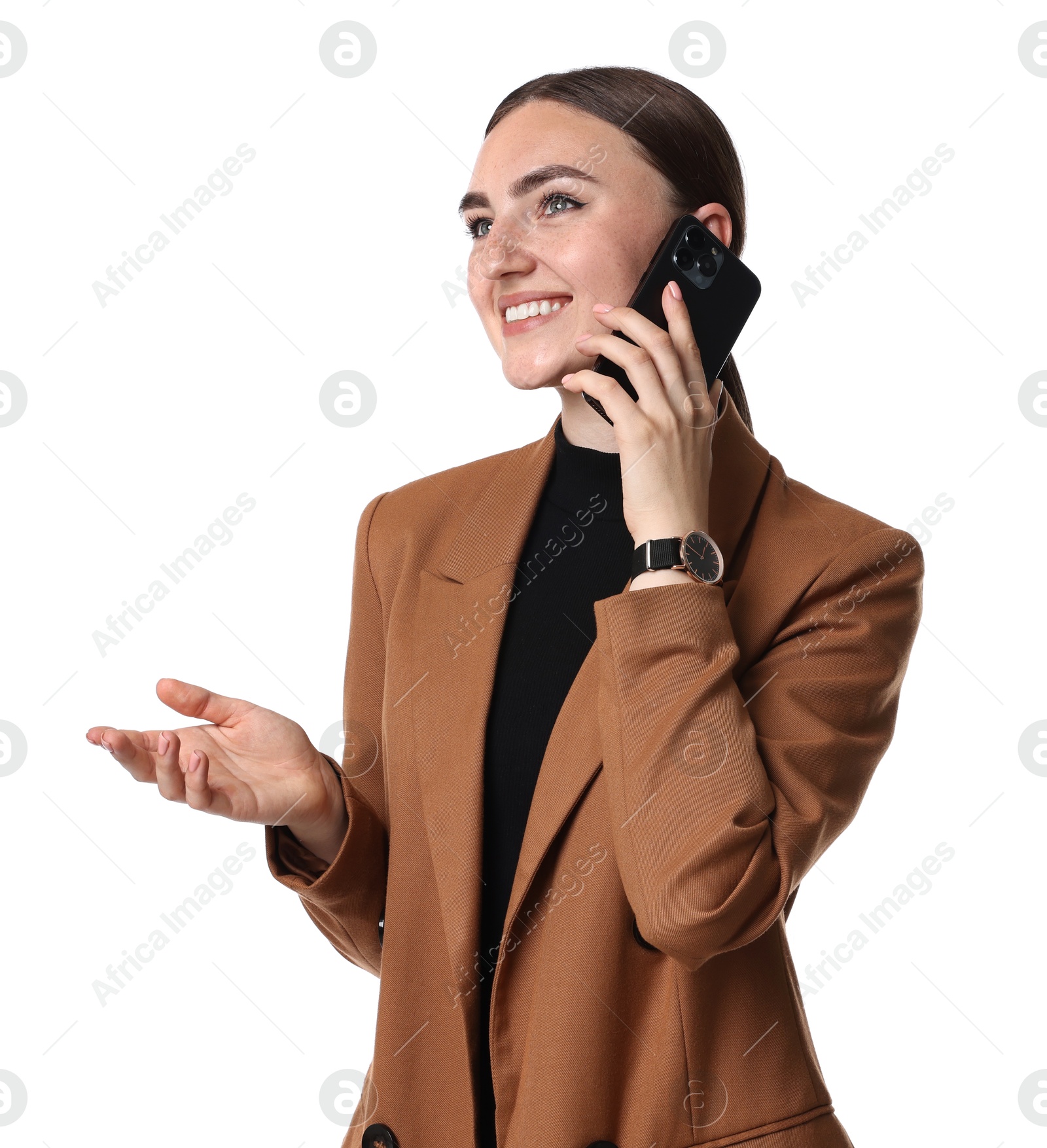 Photo of Beautiful woman in brown jacket talking on smartphone against white background