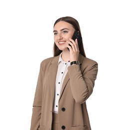 Beautiful woman in beige suit talking on smartphone against white background