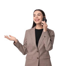 Beautiful woman in beige suit talking on phone against white background