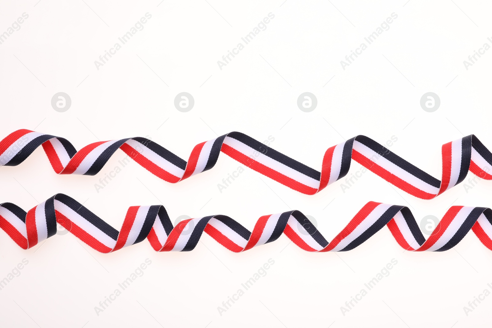 Photo of Ribbon in colors of Yemeni flag isolated on white, top view