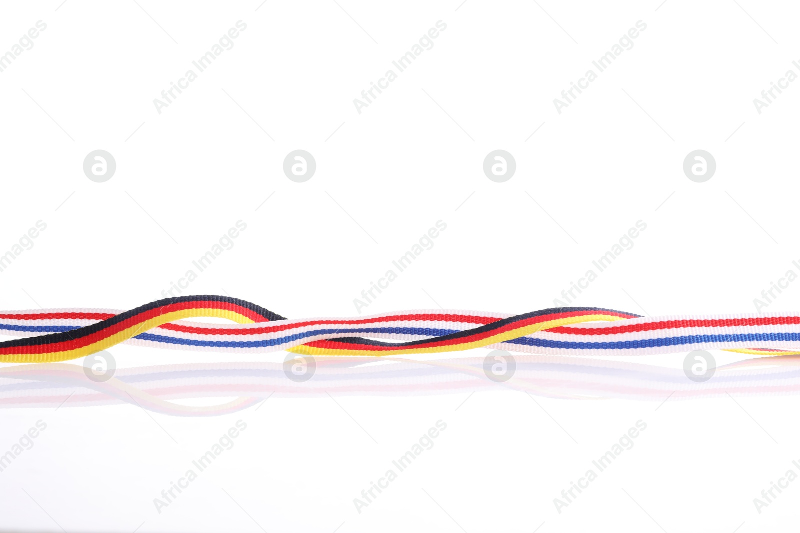 Photo of Ribbons in colors of different flags isolated on white