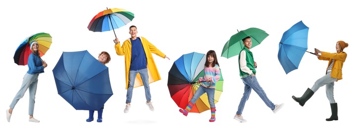 Adults and kids with bright umbrellas on white background