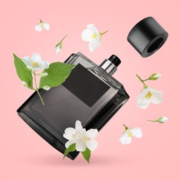 Image of Bottle of floral perfume and jasmine flowers in air on pink background