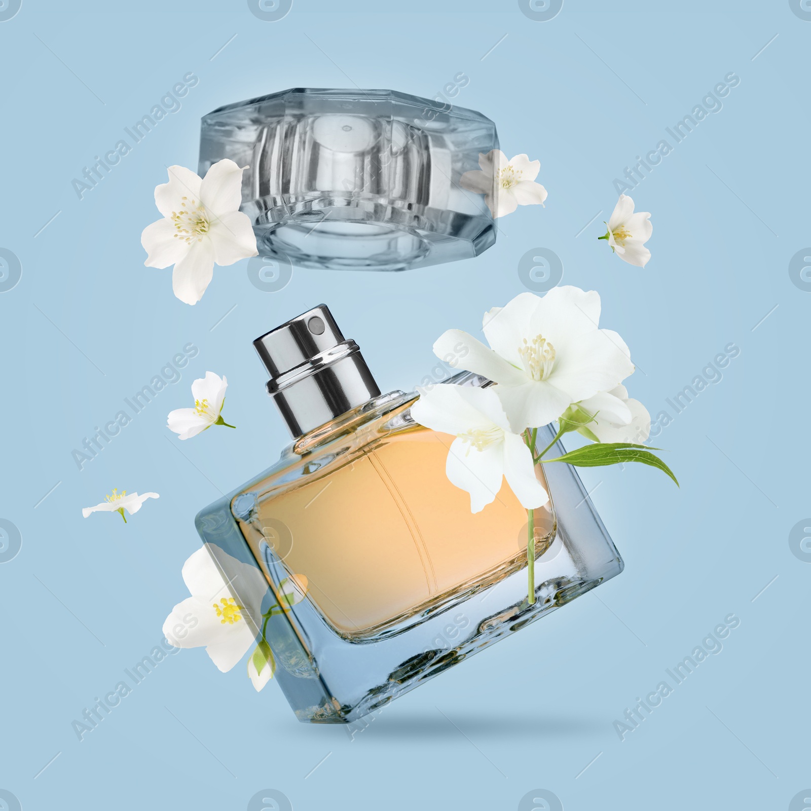 Image of Bottle of floral perfume and jasmine flowers in air on light blue background