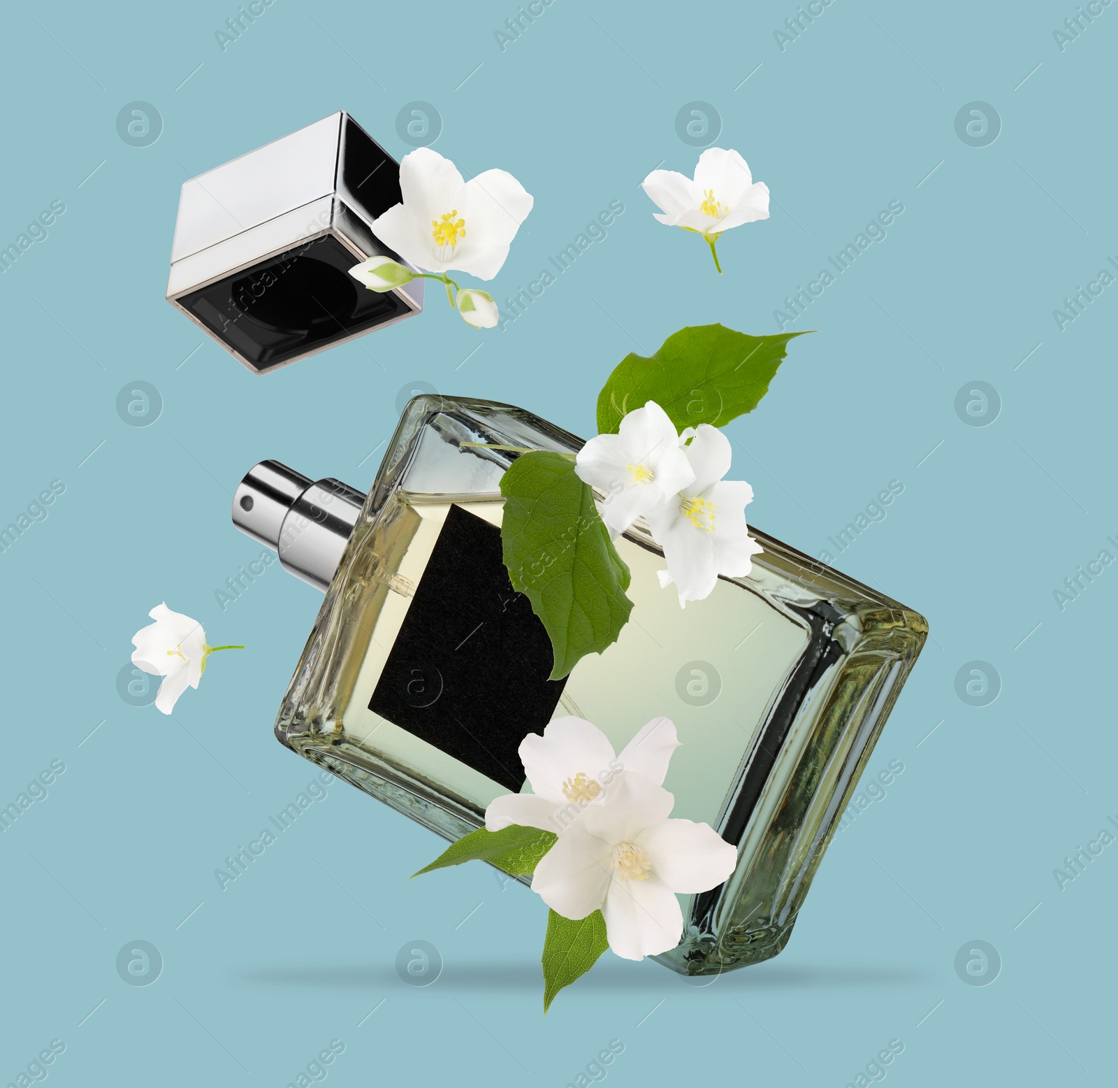 Image of Bottle of floral perfume and jasmine flowers in air on light blue background