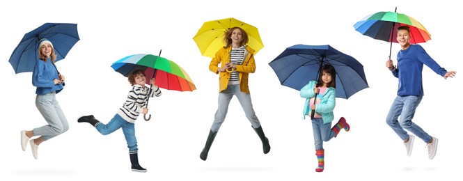 Adults and kids with bright umbrellas on white background