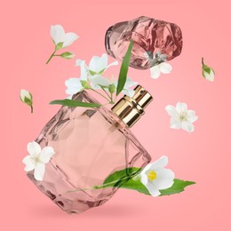 Image of Bottle of floral perfume and jasmine flowers in air on pink background