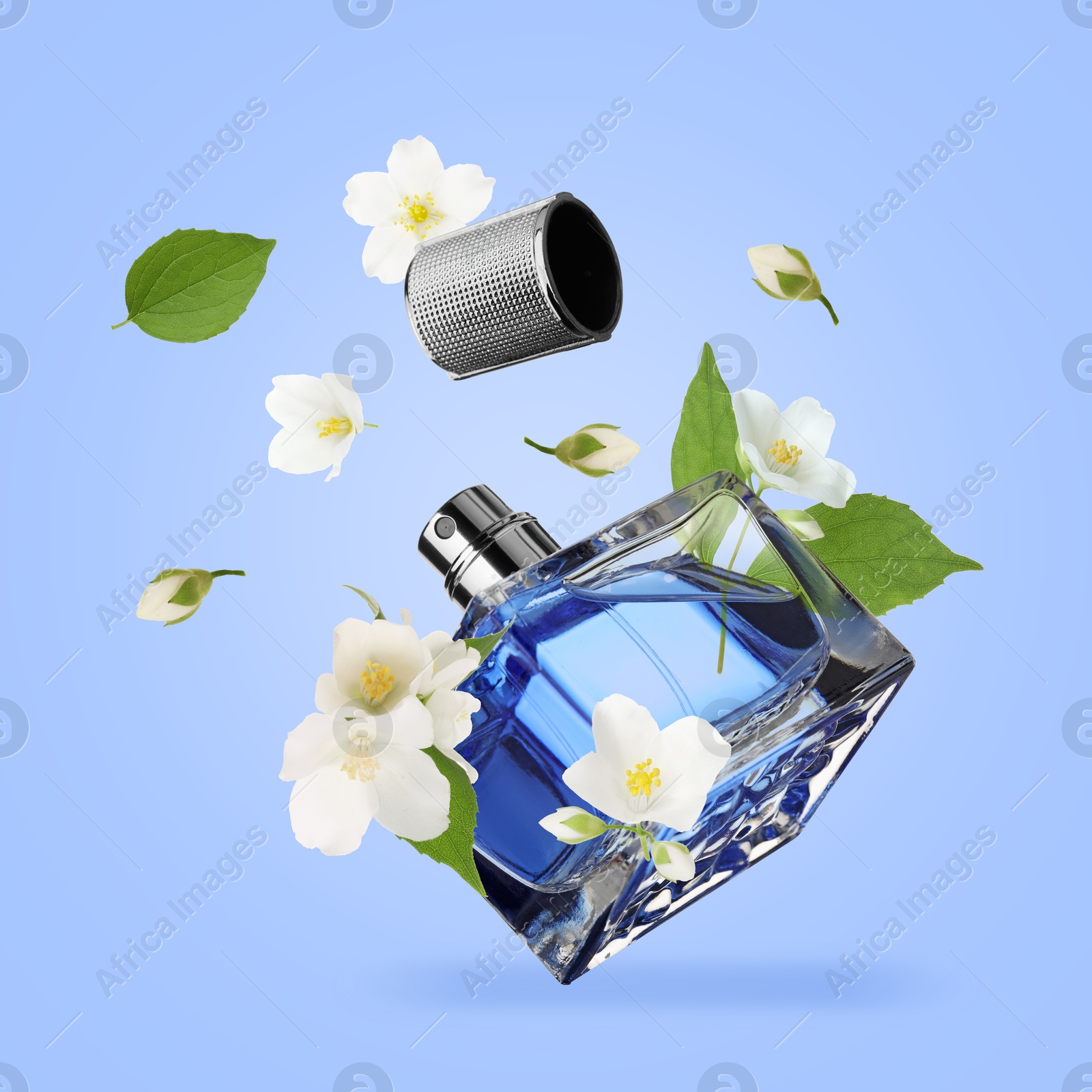 Image of Bottle of floral perfume and jasmine flowers in air on light blue background