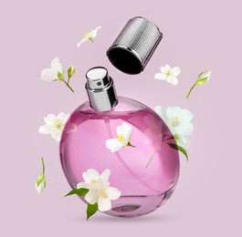 Bottle of floral perfume and jasmine flowers in air on color background