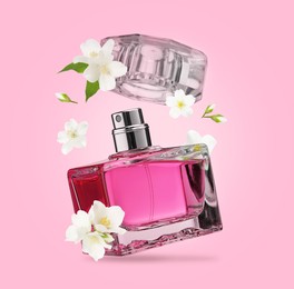 Bottle of floral perfume and jasmine flowers in air on pink background