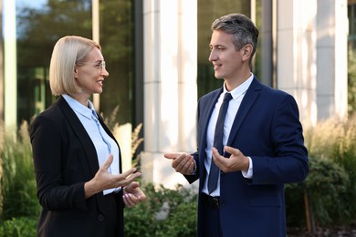 Photo of International relations. Diplomats talking during meeting outdoors