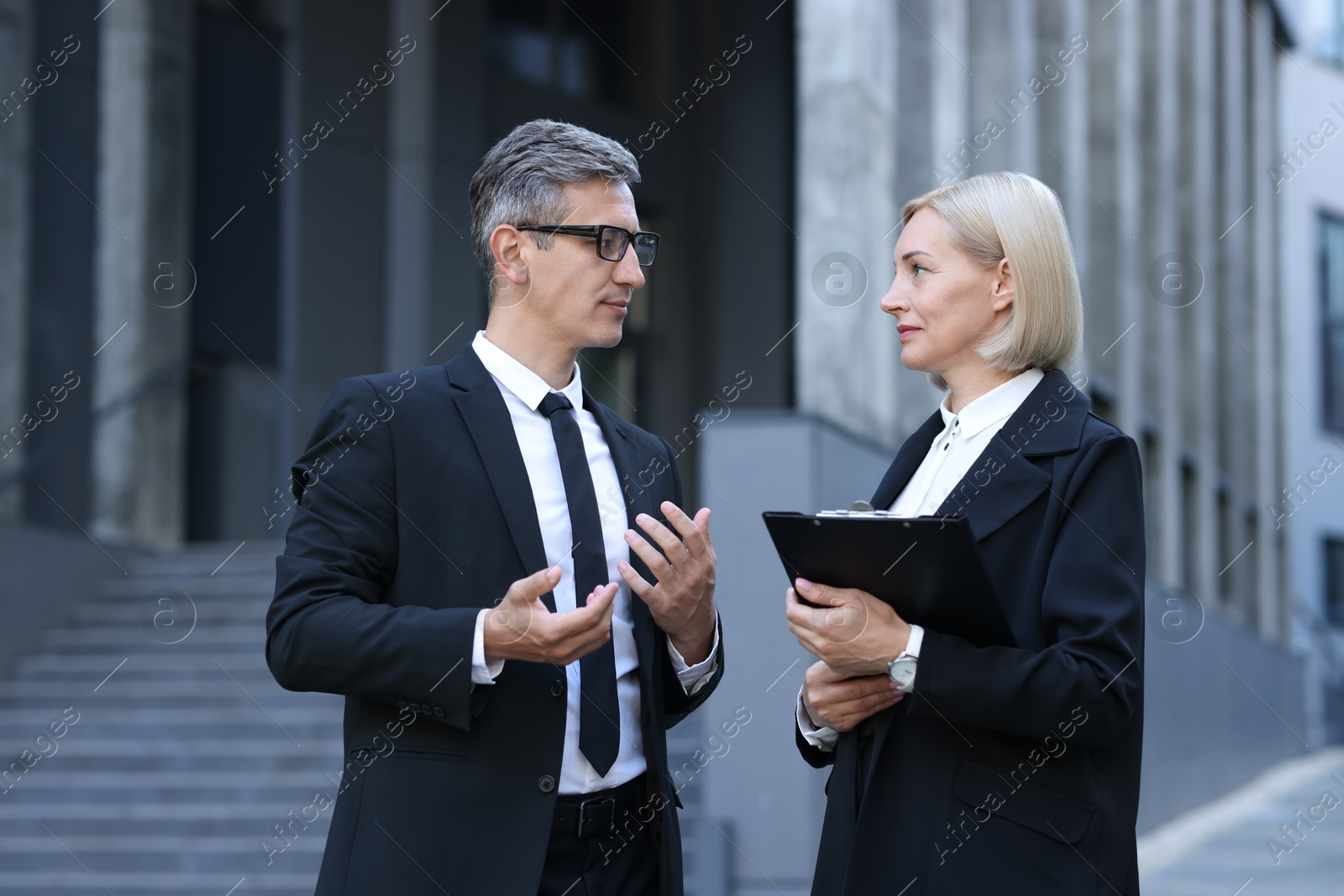 Photo of International relations. Diplomats talking during meeting outdoors