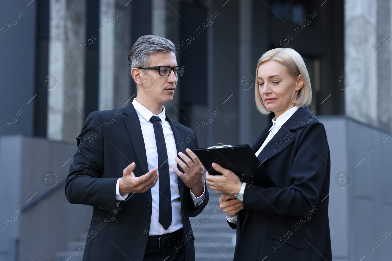 Photo of International relations. Diplomats talking during meeting outdoors