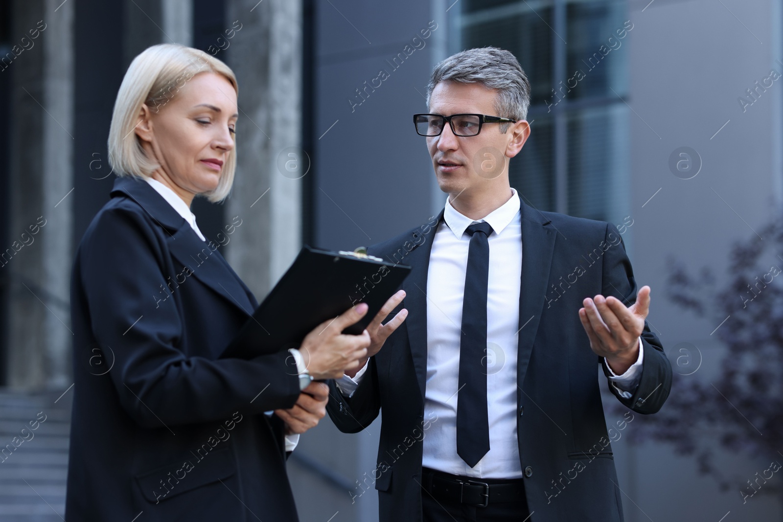 Photo of International relations. Diplomats talking during meeting outdoors