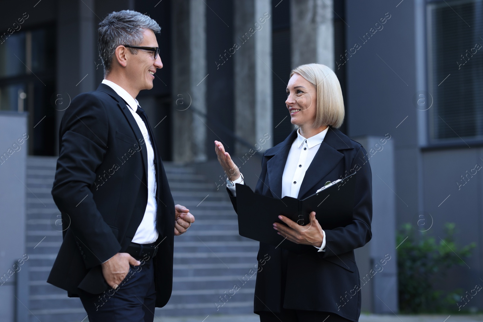 Photo of International relations. Diplomats talking during meeting outdoors