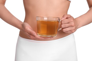 Photo of Weight loss concept. Woman with cup of diet tea on white background, closeup